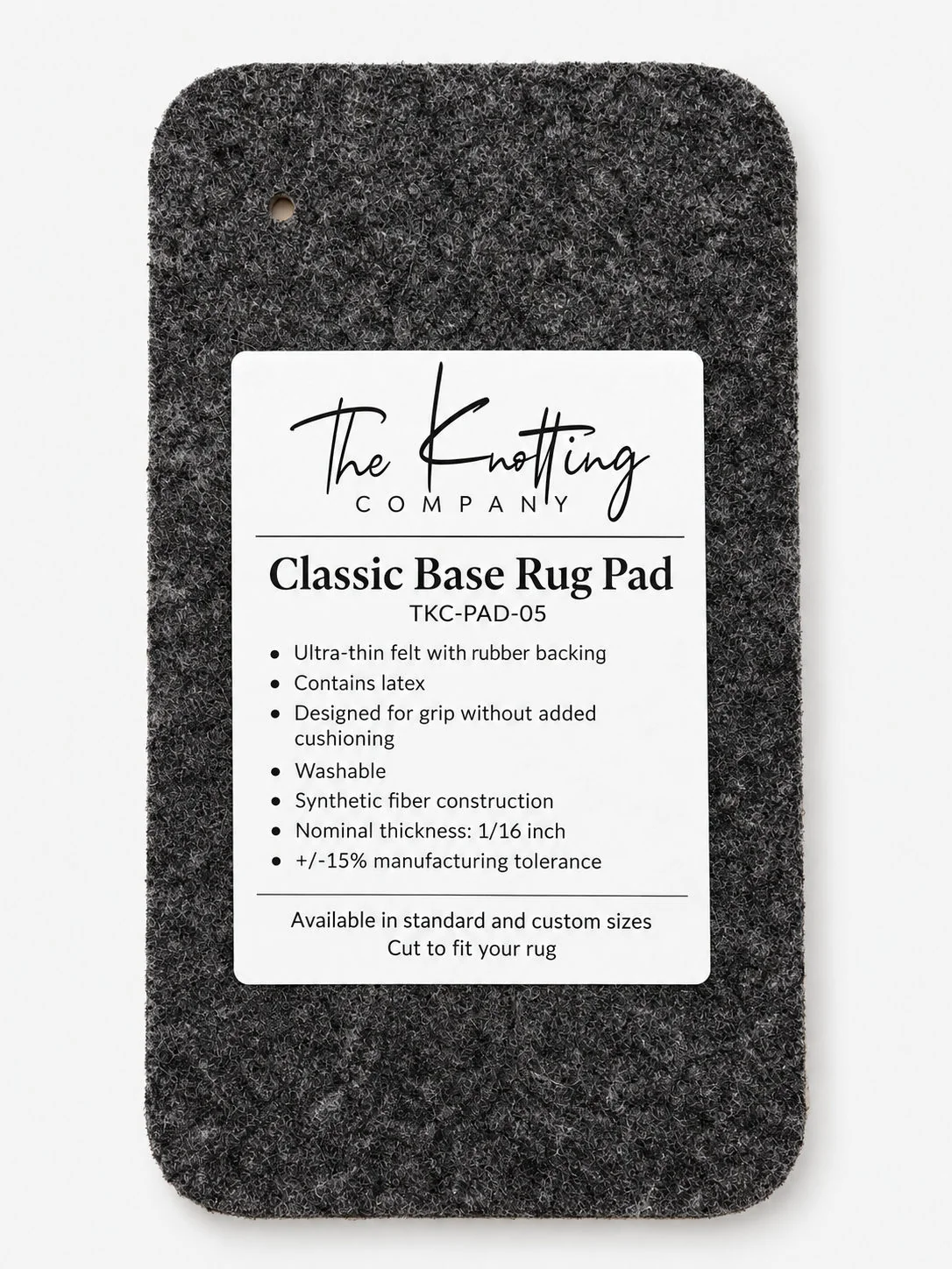 Classic Base rug pad shown beneath a folded area rug