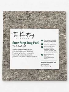 Sure Step rug pad shown beneath a folded area rug