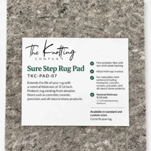 Sure Step rug pad shown beneath a folded area rug