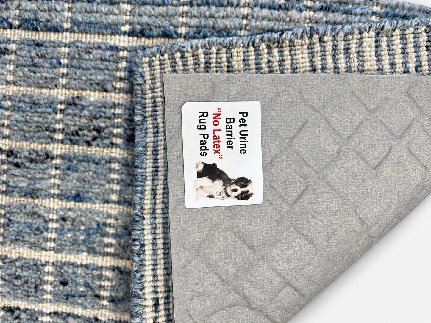 Everyday Support rug pad shown beneath a folded area rug